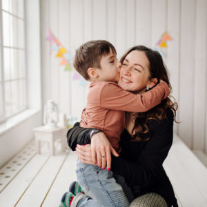 mother-her-son-are-posing-studio-wearing-casual-clothes-scaled.jpg